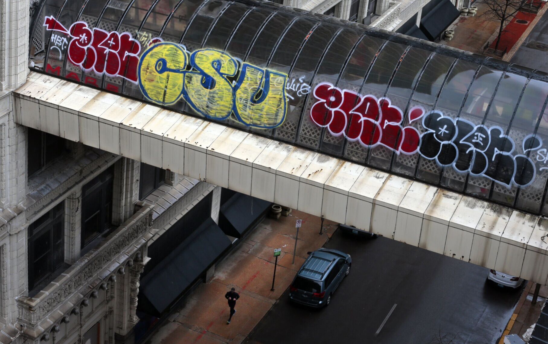 Grafitti covers former Railway Exchage pedestrian bridge in March 2022 as St. Louis population dips below 300,000